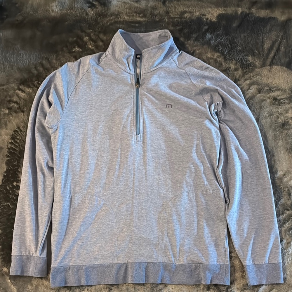 Travis Matthew’s Blue Quarter-Zip Sweater